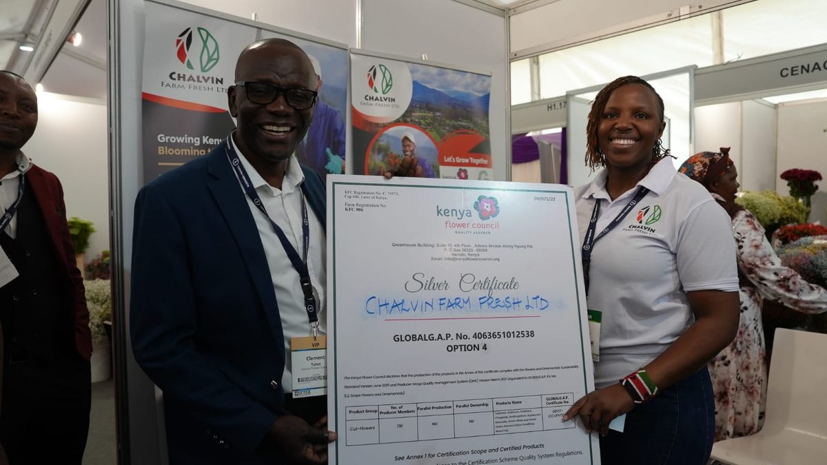 Kenya Flower Council CEO presenting the KFC Silver Certificate to Chalvin Farm Fresh